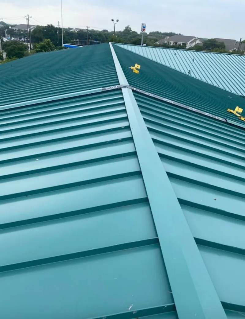 Green commercial metal roof ridge and valley for Metal Roof Repair in Choctaw